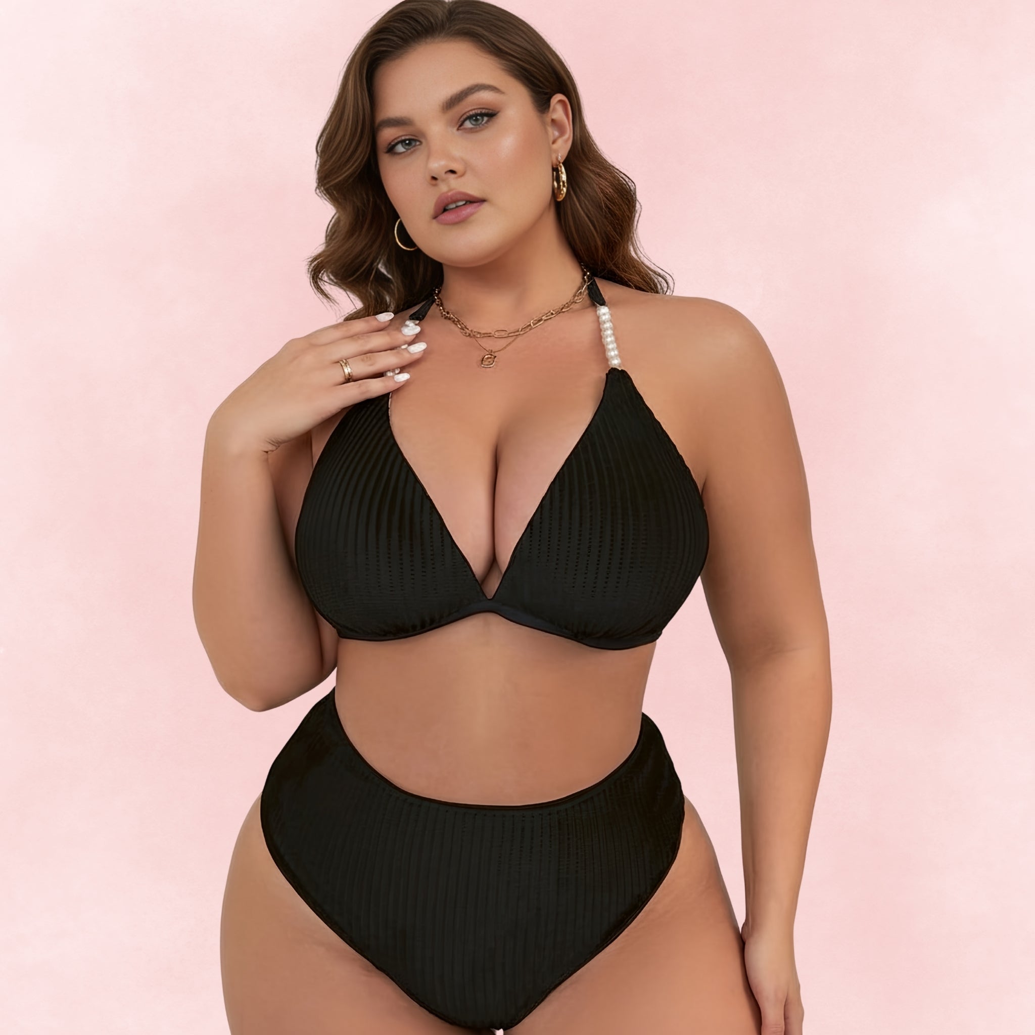 Front view of plus size woman in black ribbed bikini featuring pearl strap halter top and matching high waist bottoms