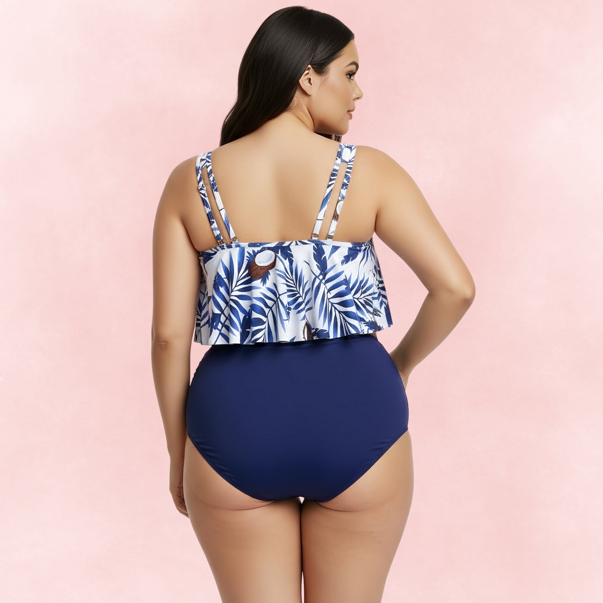 Plus size bikini with white and blue coconut leaf print ruffle top and navy high waist bottoms, back view