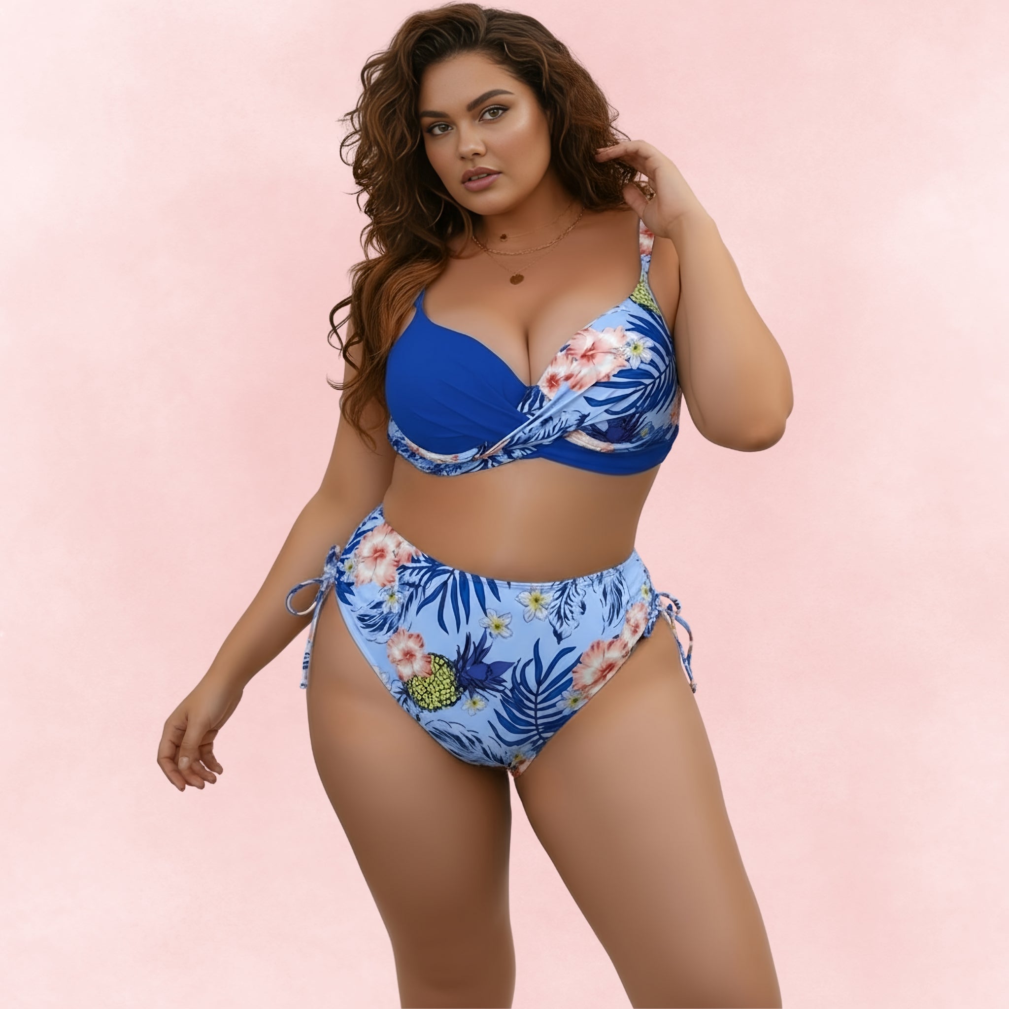 Plus size blue bikini with tropical floral design, high waist bottom and twisted supportive bikini top.
