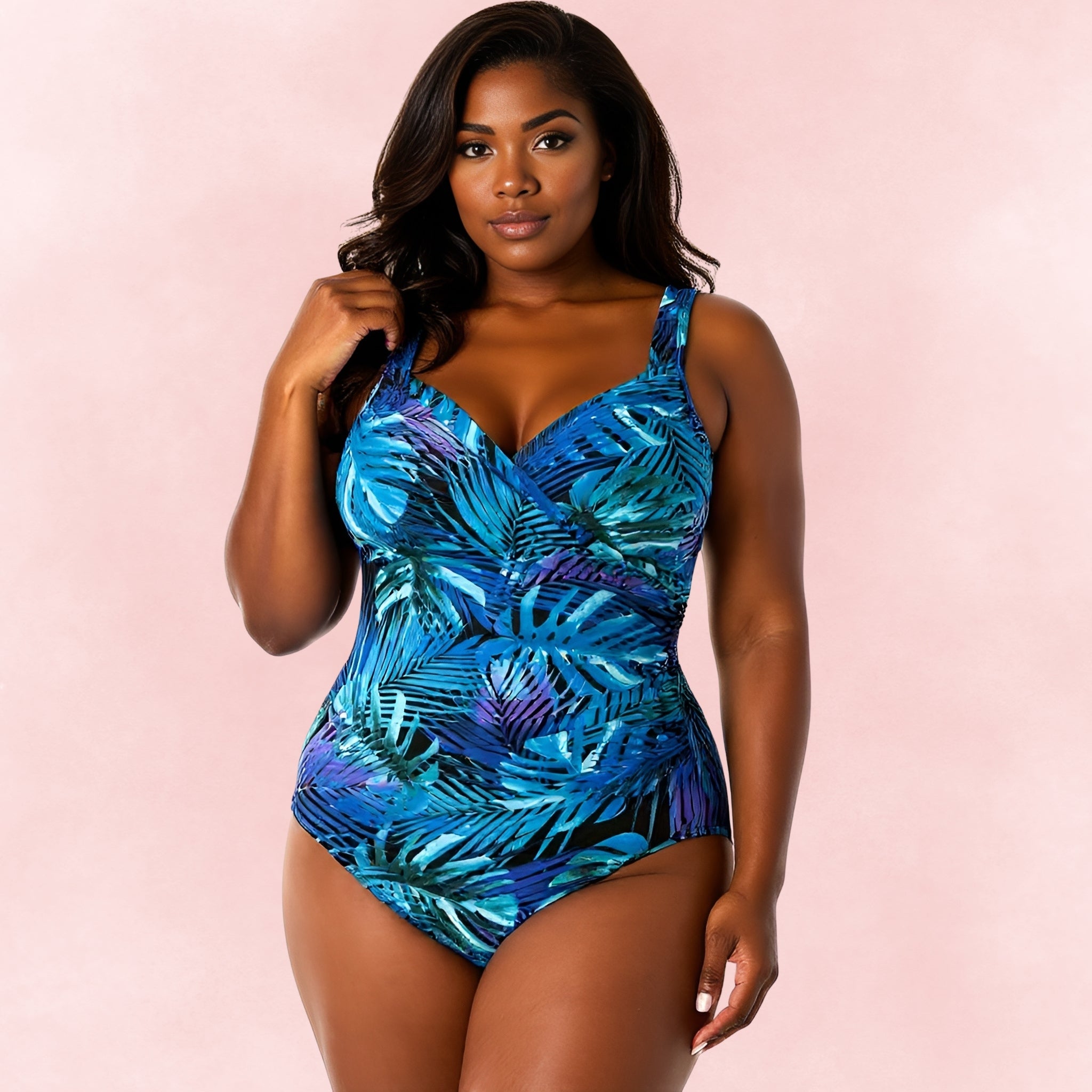 Plus size one-piece swimsuit with blue and purple tropical leaf print, front view