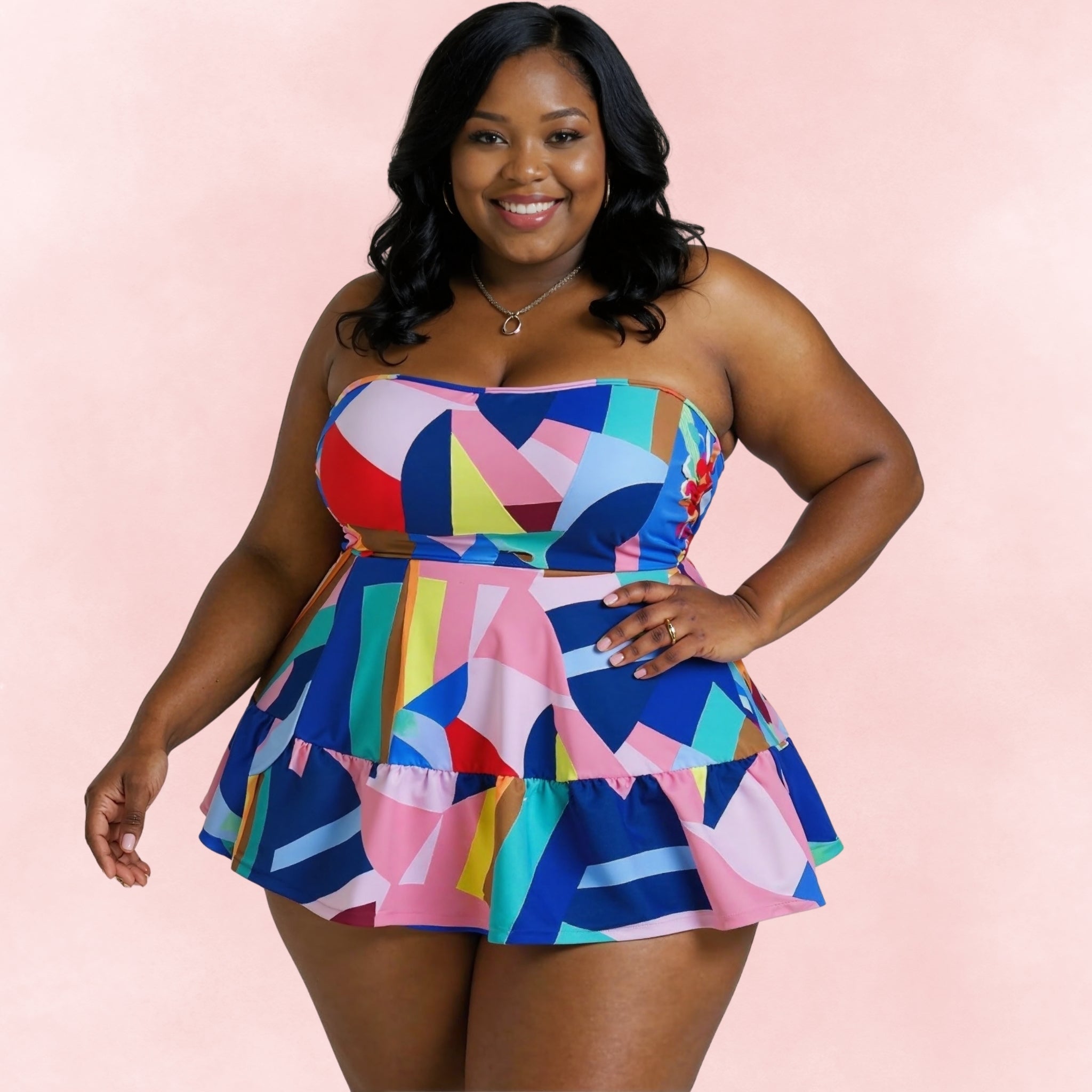 Plus size one-piece swimsuit with multicolor geometric print and skirted hem, front view