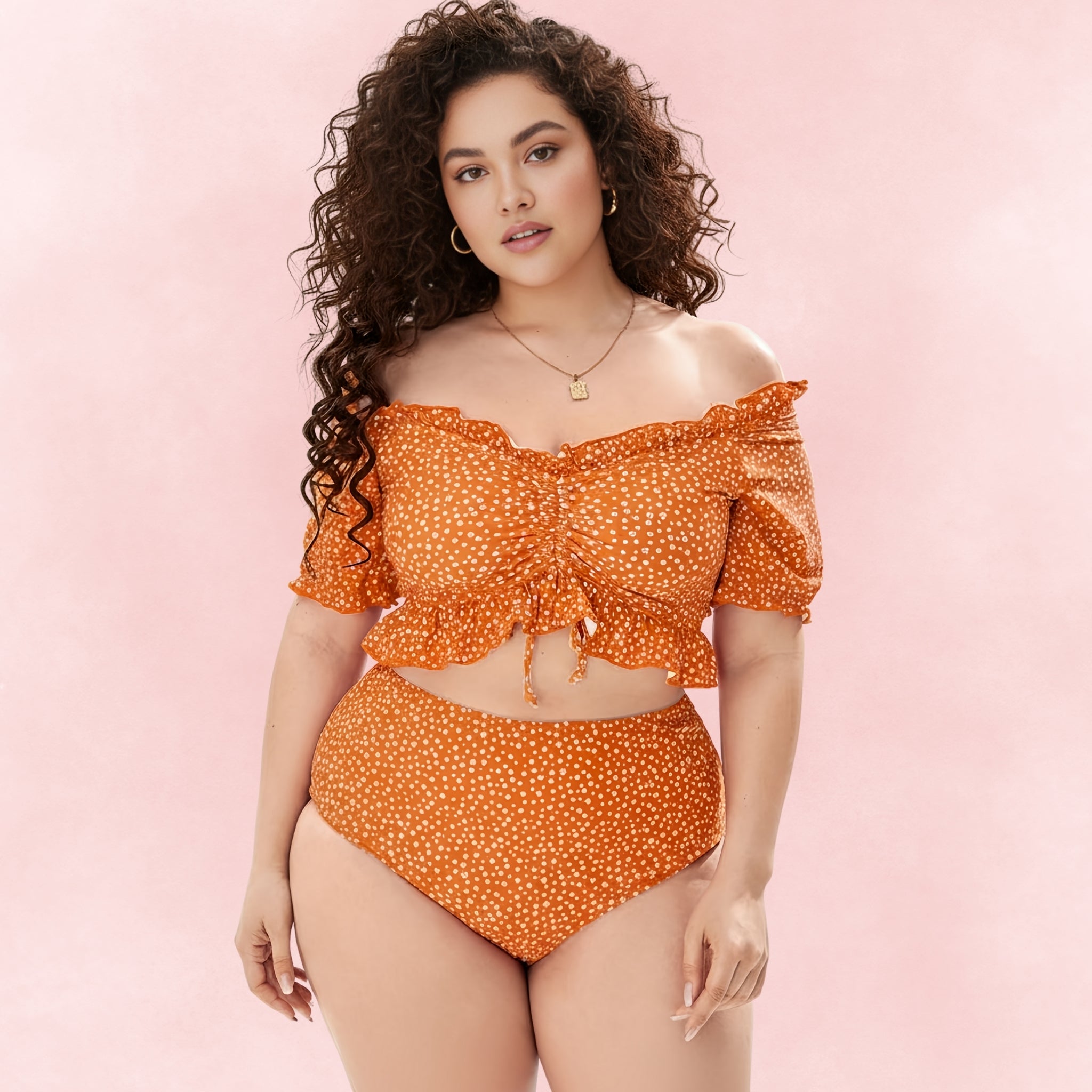 Front view of orange off-shoulder bikini set featuring ruffled cropped top and high-waisted bottoms.