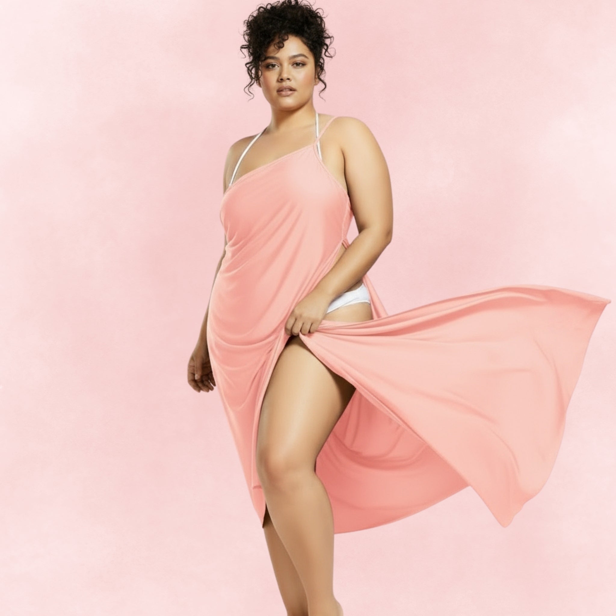 Soft peach asymmetrical sarong cover-up, featuring a flowy design ideal for summer beachwear and poolside looks