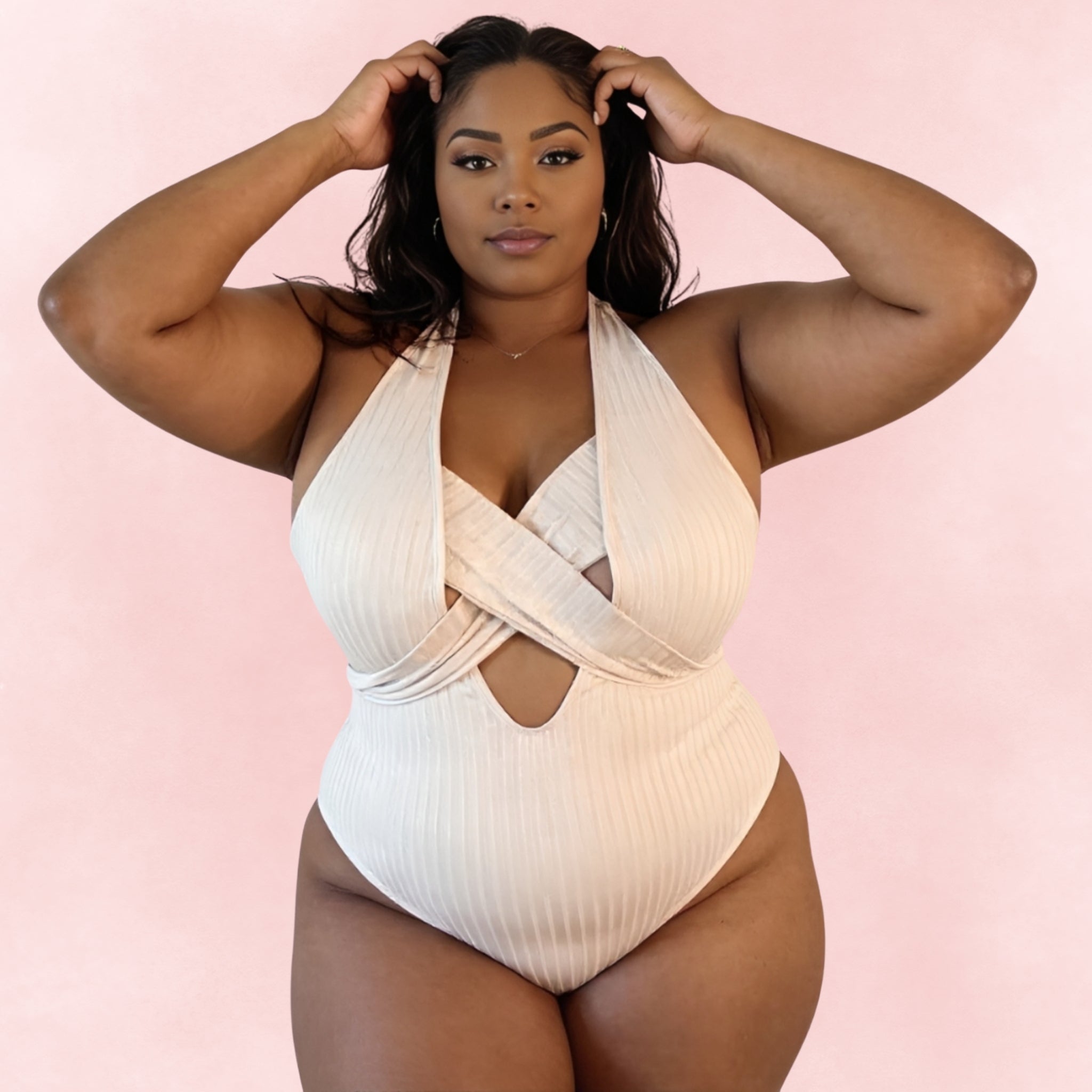 Plus size beige ribbed one-piece swimsuit with crisscross halter neckline and cutout front