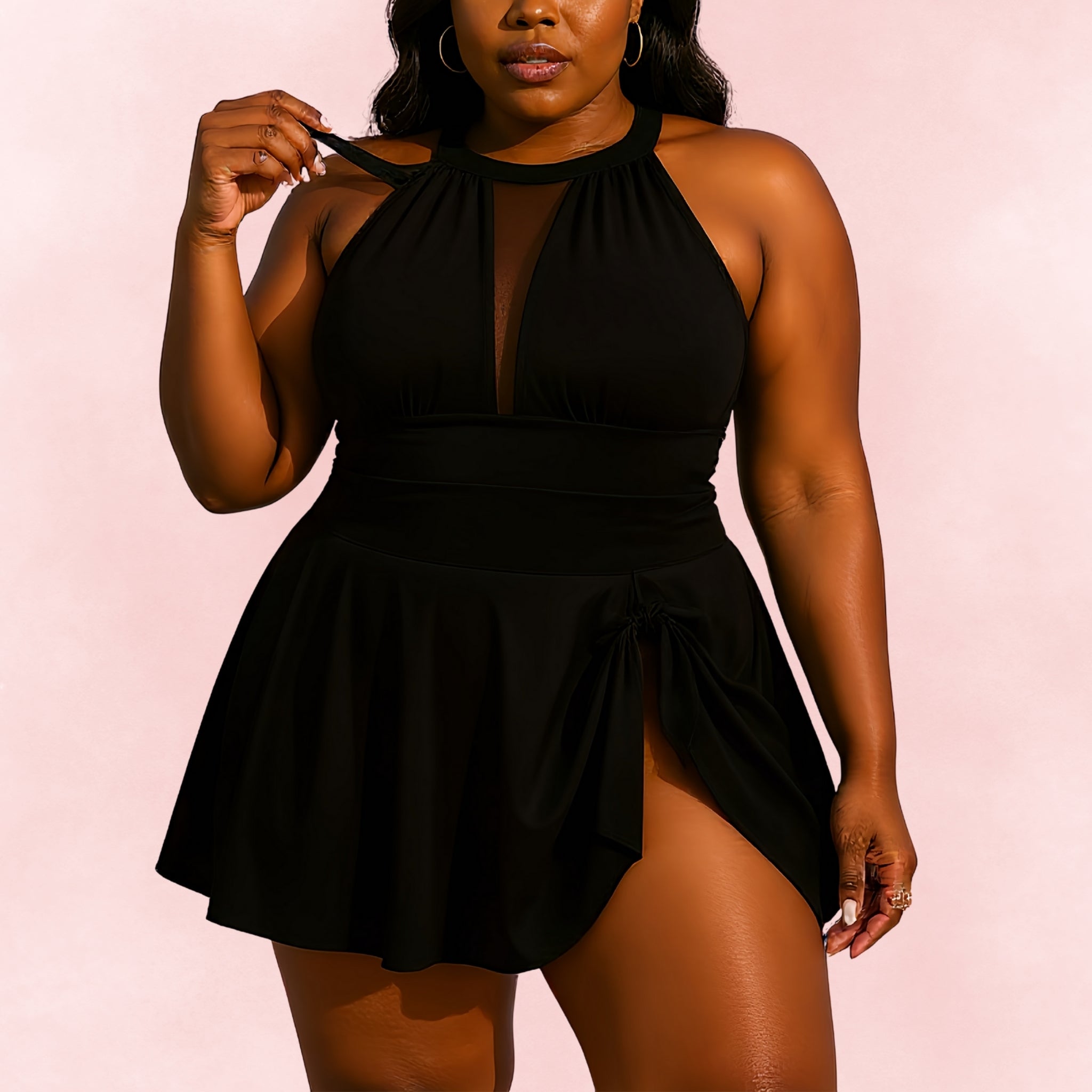 Plus size black swimdress with halter mesh neckline and draped tie skirt
