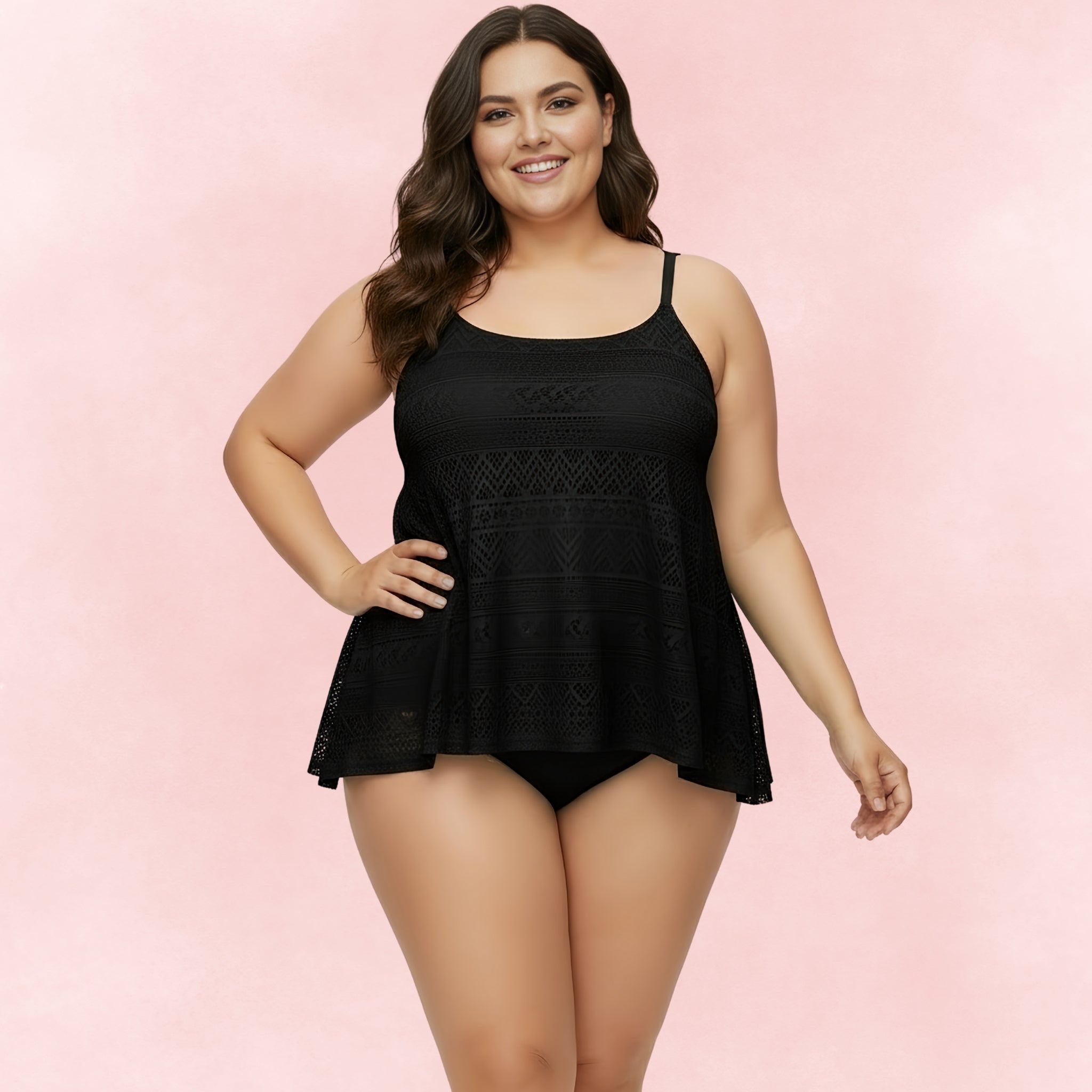 Plus size black lace tankini with spaghetti straps and flowy overlay, paired with bikini briefs.