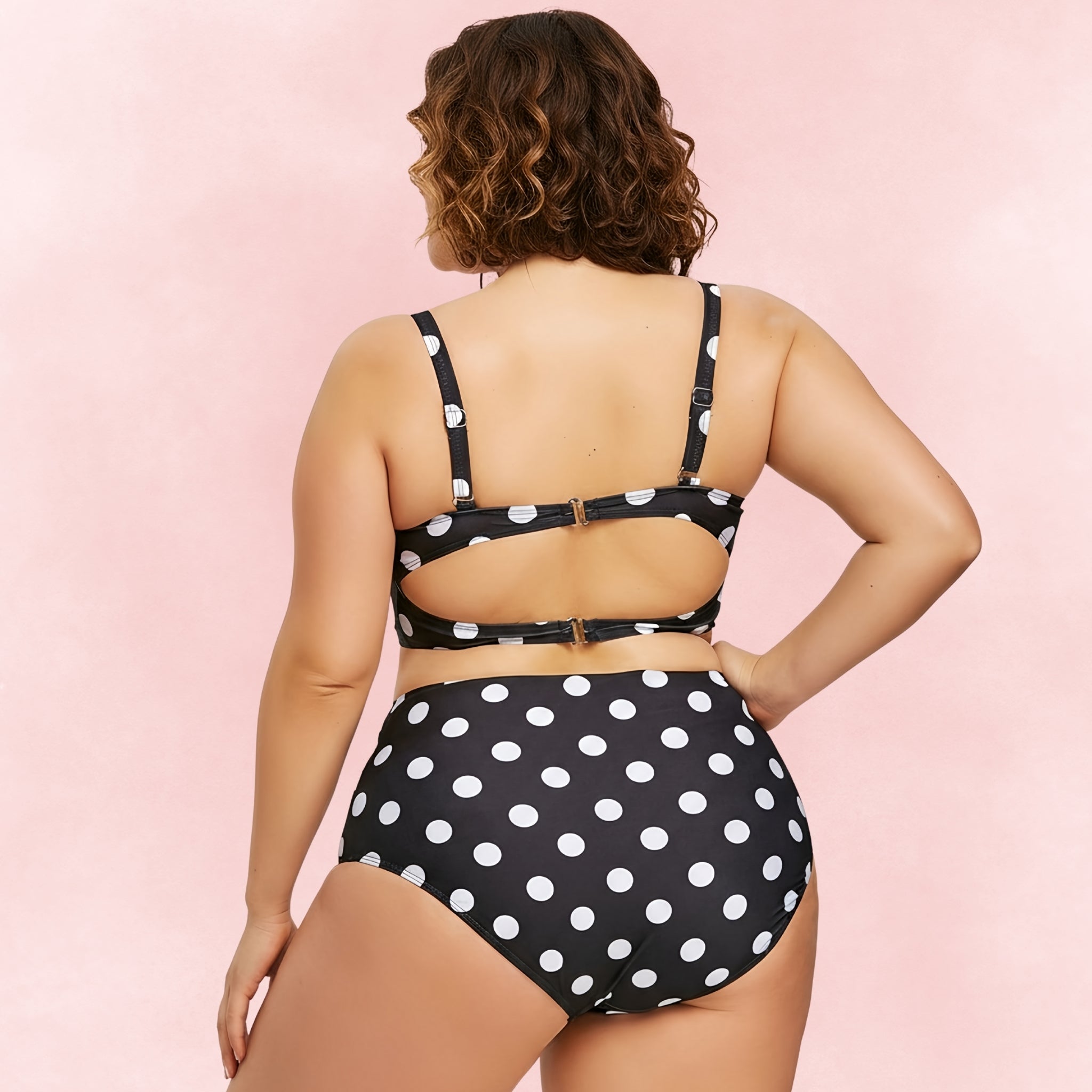 Plus size black polka dot bikini with high waist bottoms and double clasp back design – back view.