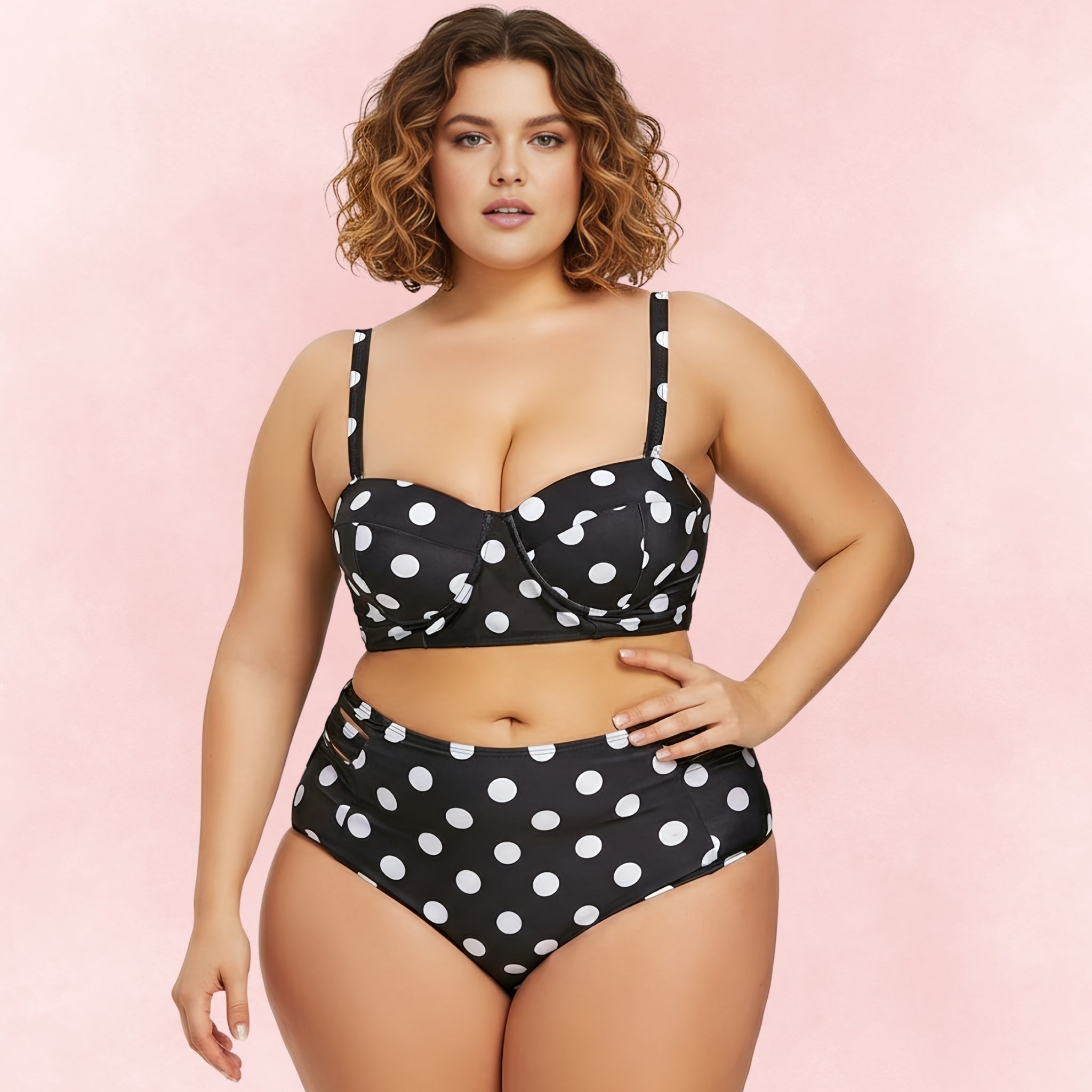 Plus size black polka dot bikini with high waist bottoms and supportive balconette top – front view.