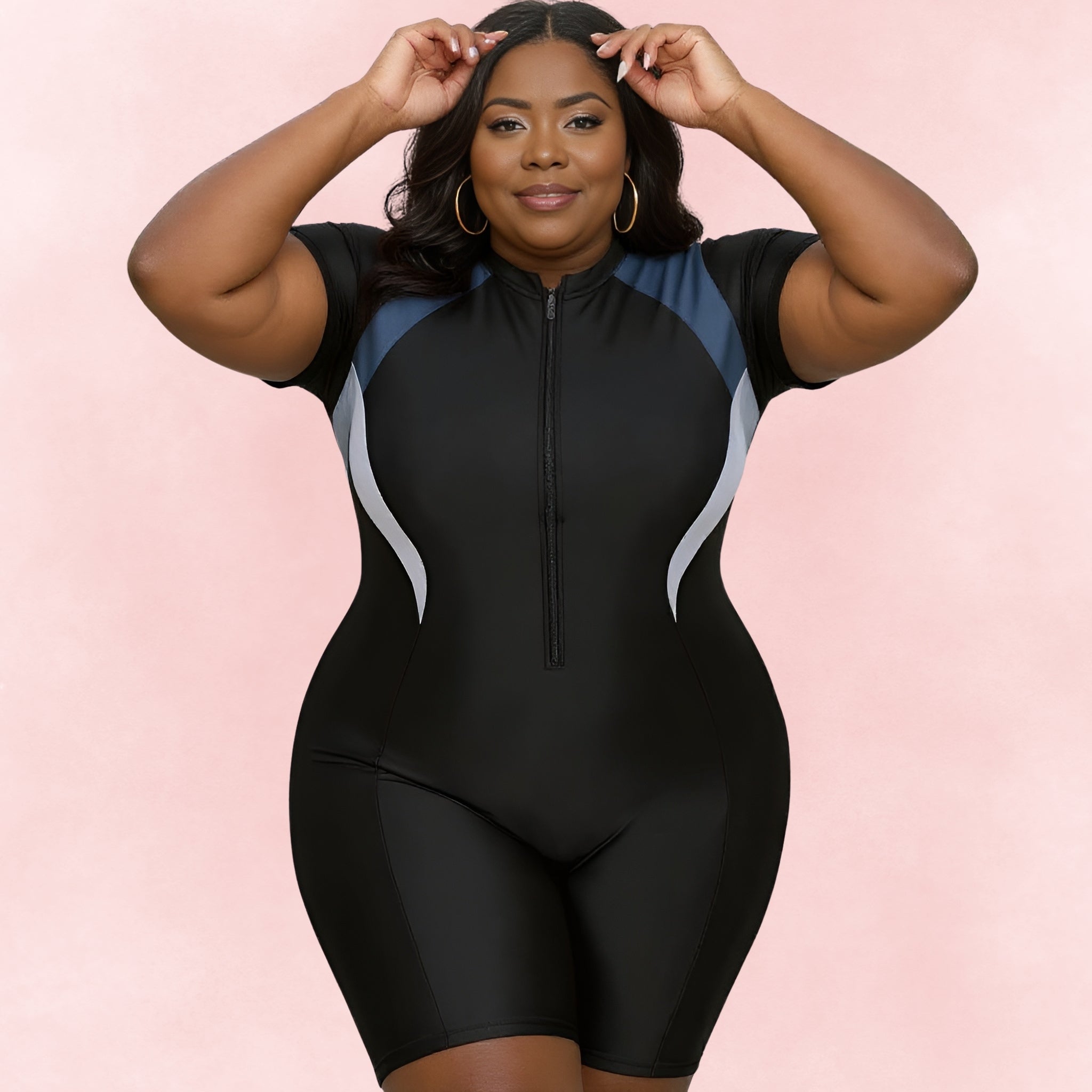 Plus size sporty black swimsuit with blue and gray side accents, front zipper, and short sleeves.