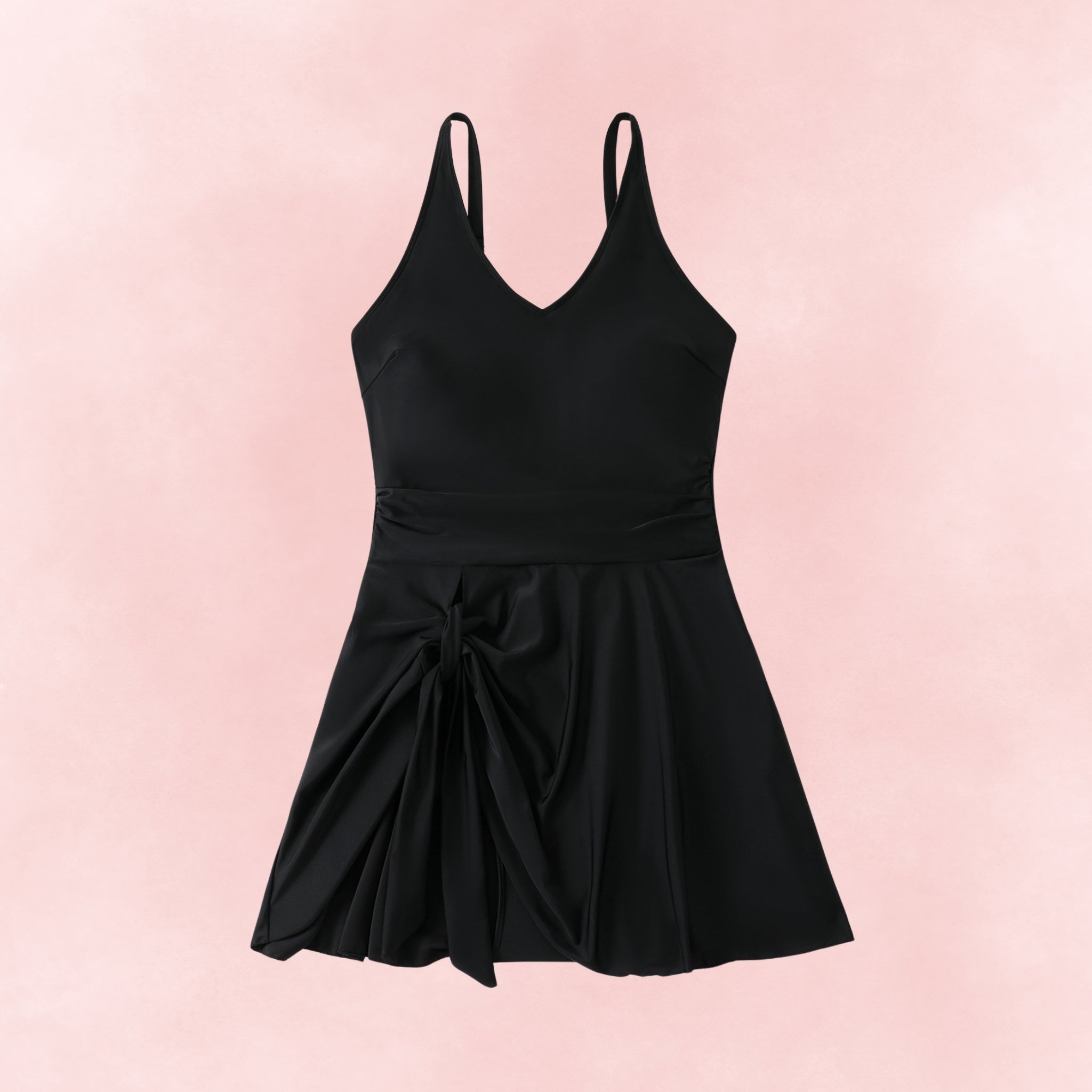 Flat lay of plus size black swimdress with side tie skirt and v-neck design