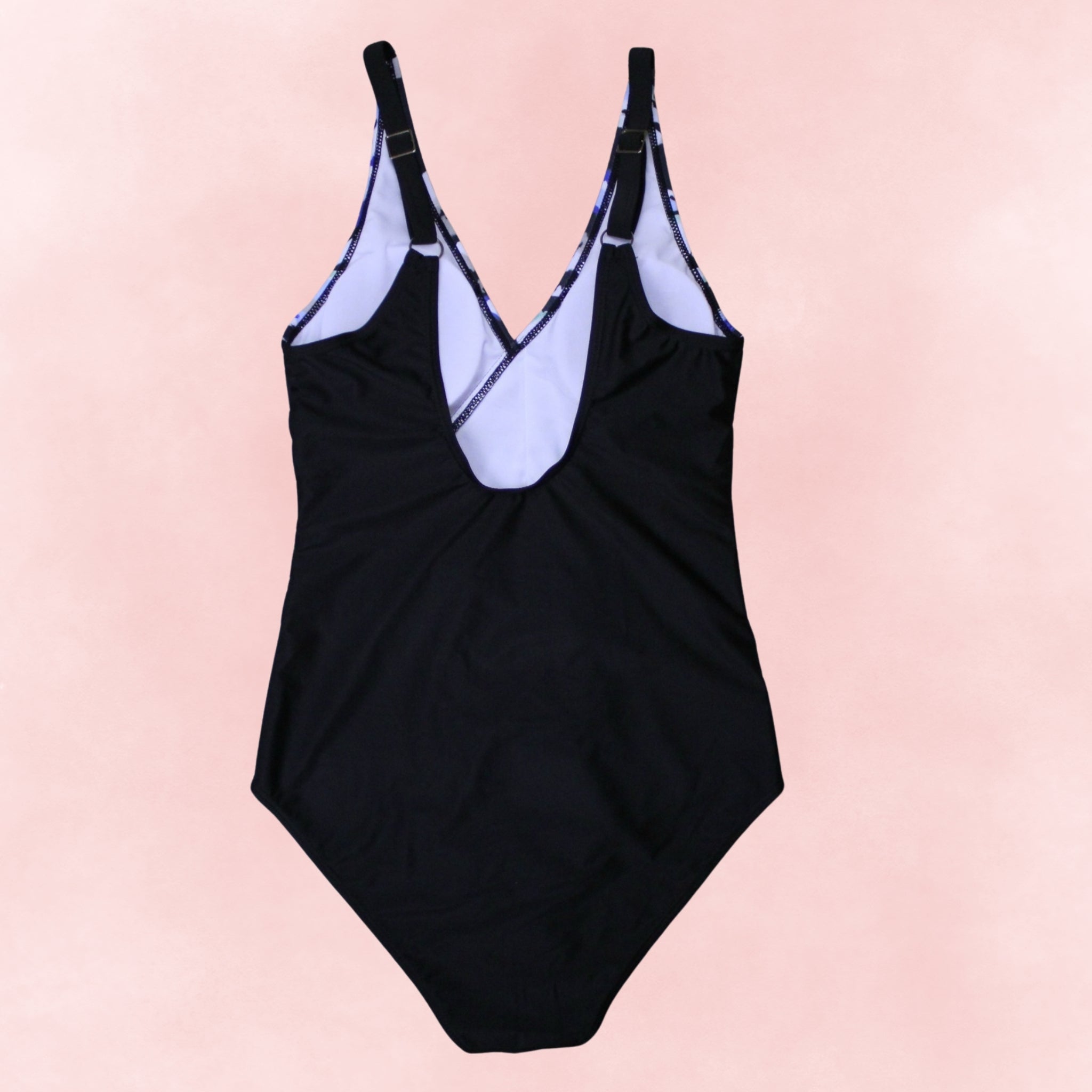 Back view flat lay of plus size one-piece swimsuit with abstract wrap print and adjustable straps
