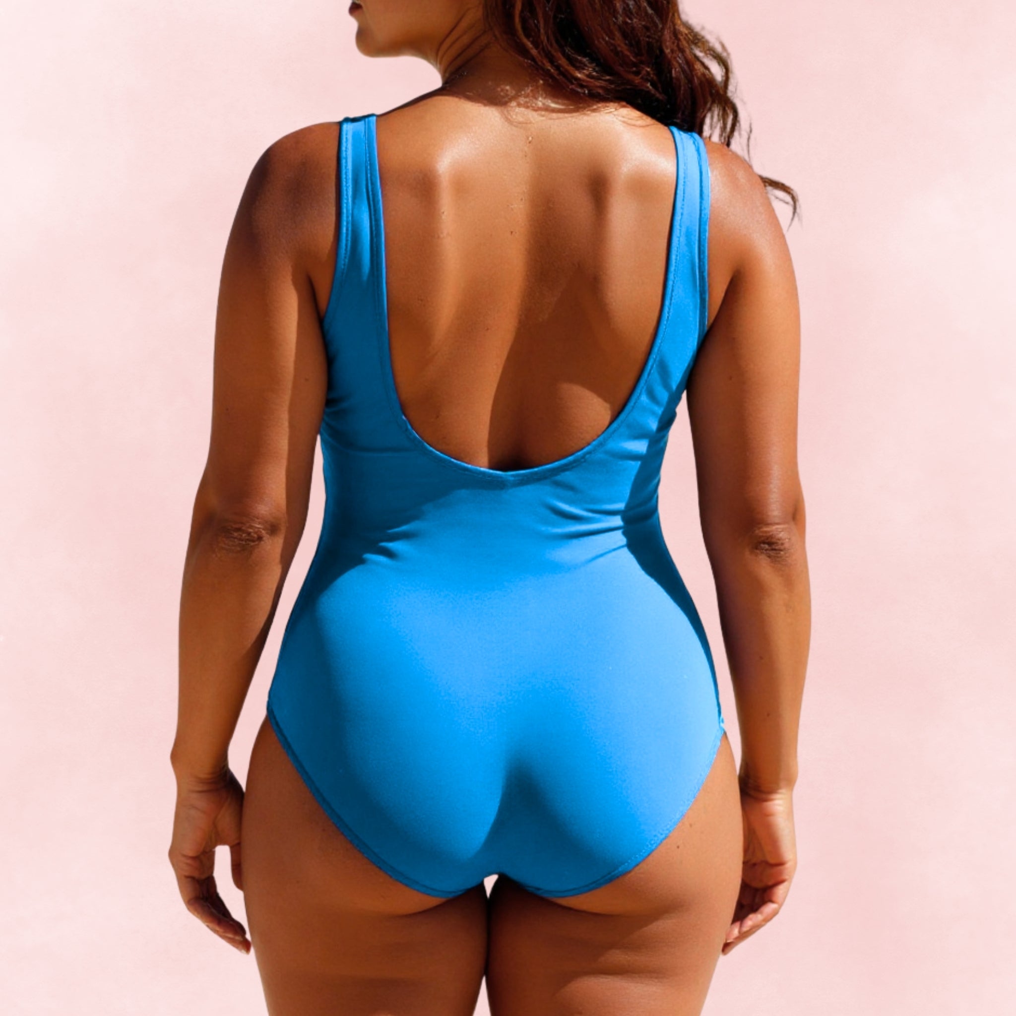 Back view of plus size blue one-piece swimsuit with low scoop back