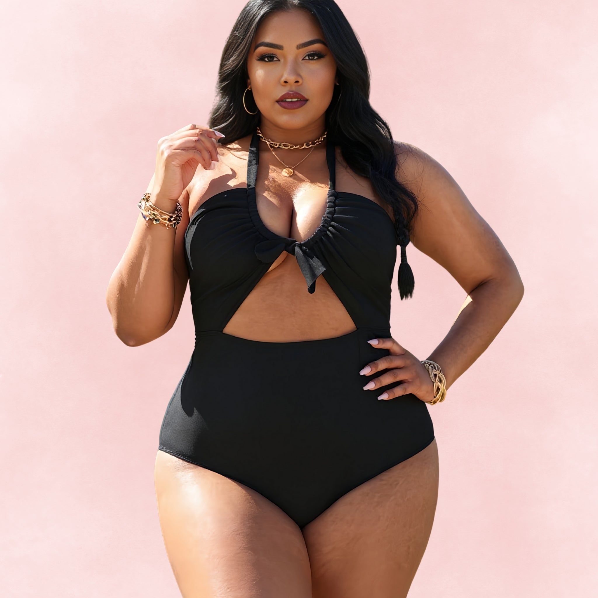 Confident model in a black plus size halter one-piece swimsuit featuring a keyhole cutout and tie-front detail, slimming fit