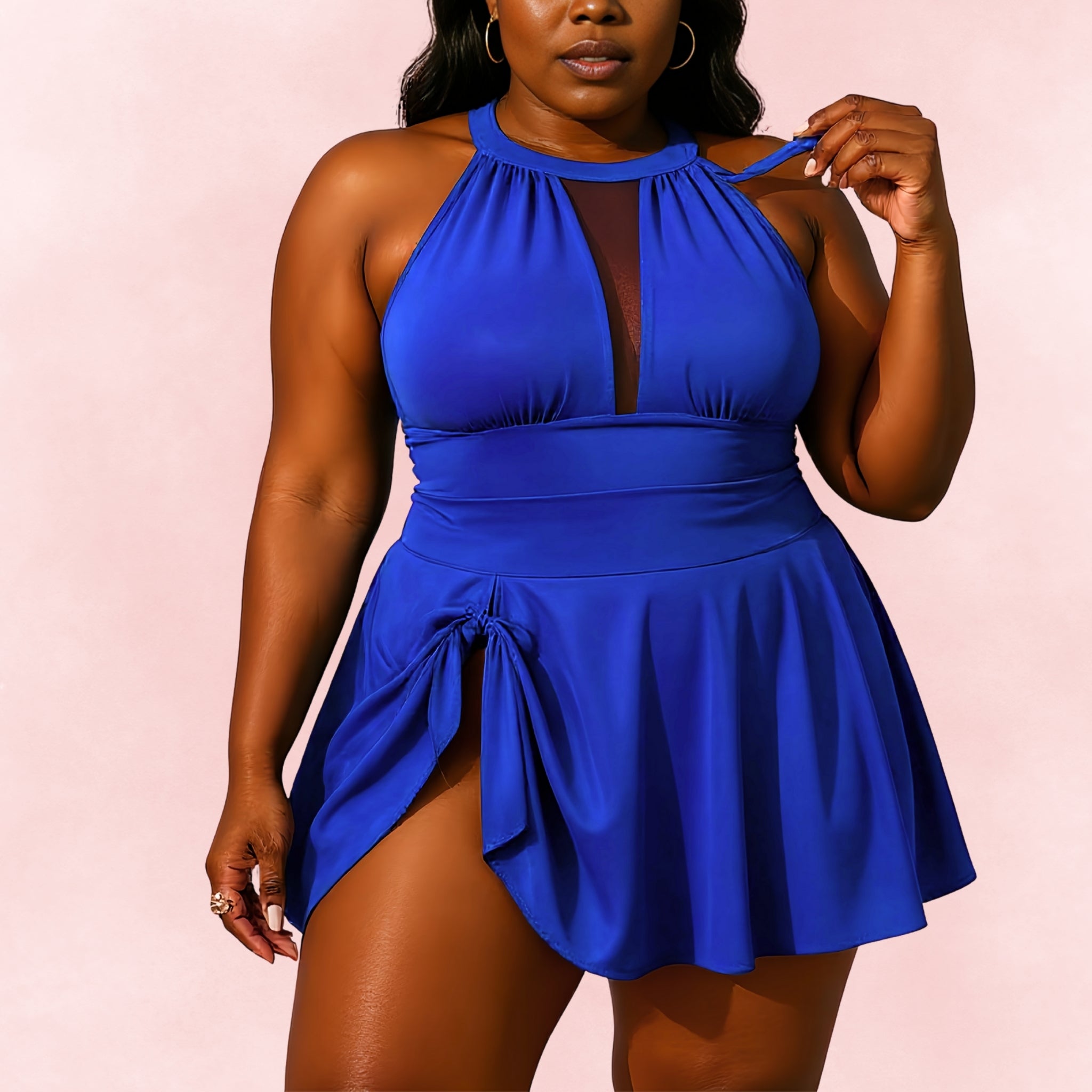 Plus size royal blue swimdress with halter neckline, sheer mesh insert and side tie skirt