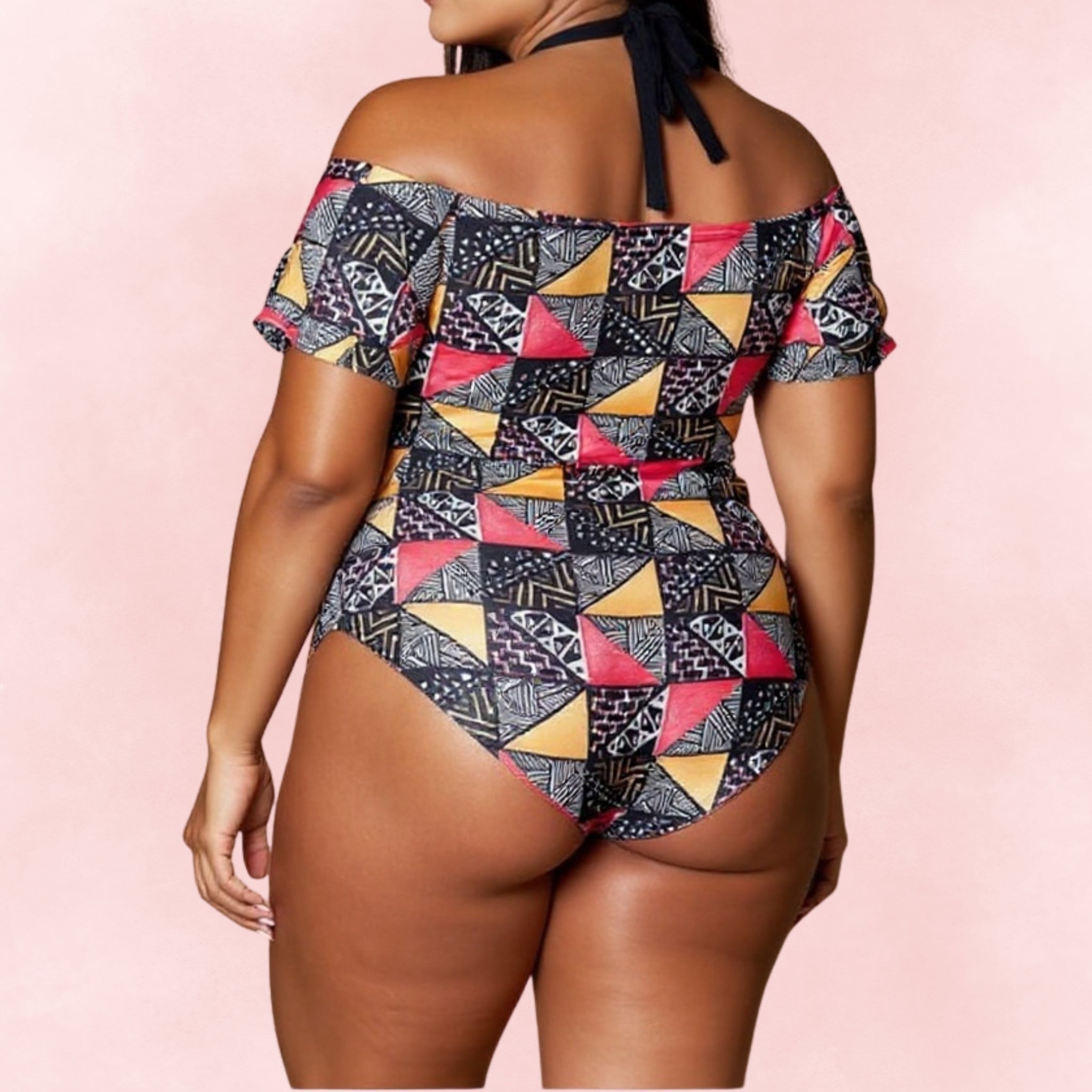 Back view of plus size one-piece swimsuit with colorful tribal geometric print and off-shoulder sleeves