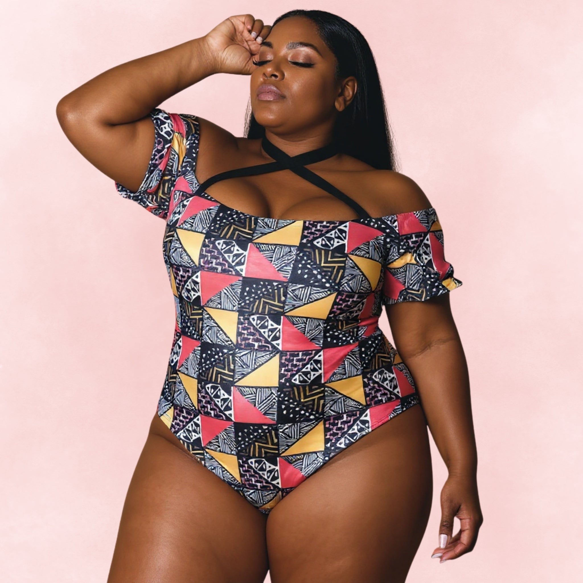 Plus size one-piece swimsuit with tribal geometric print, off-shoulder sleeves and cross-strap neckline