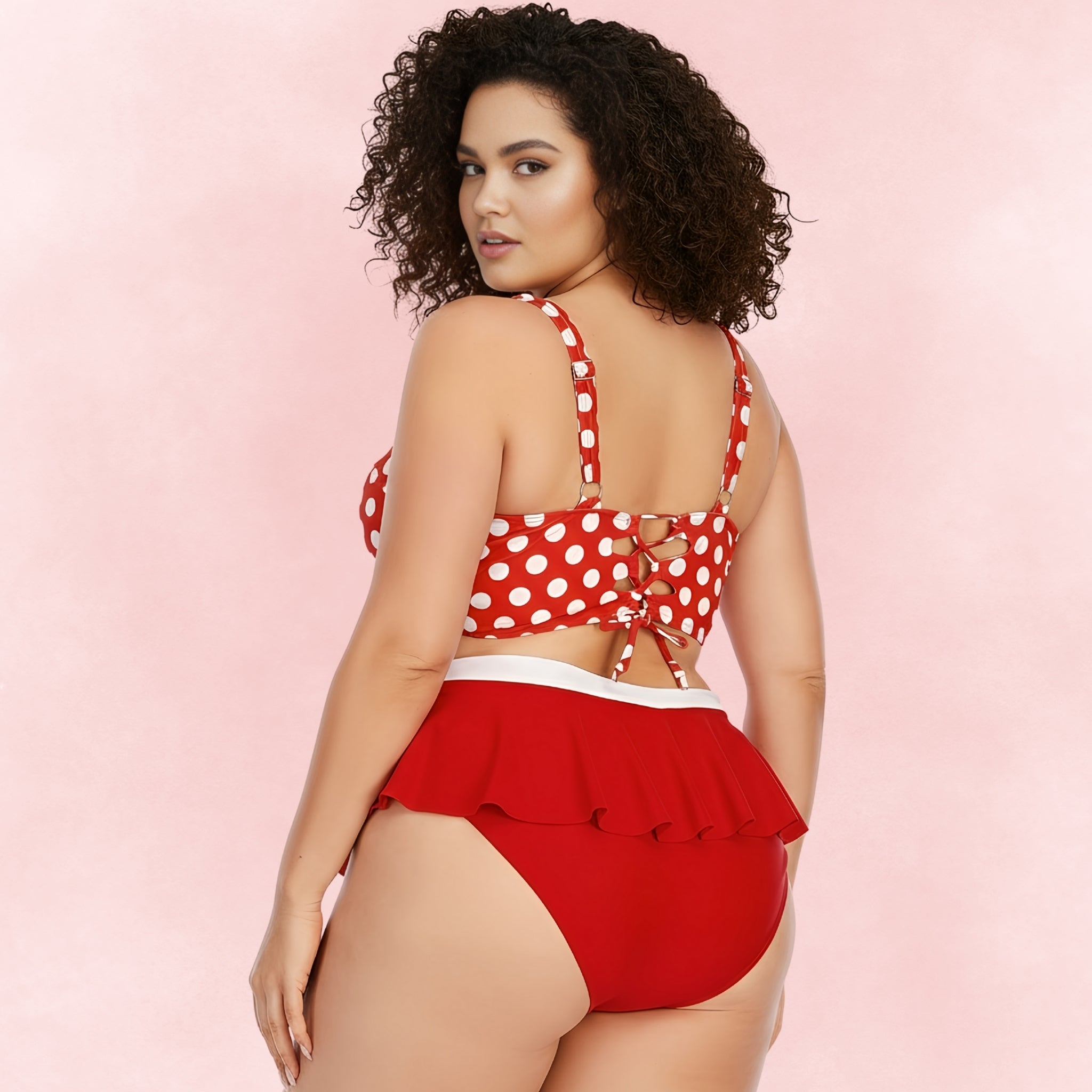 Plus size red polka dot bikini set with back lace-up tie and ruffle bottom, flattering retro swimwear style.